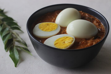 Kerala style spicy egg curry. Boiled egg in a spicy gravy of onions, tomatoes and spices. Locally known as egg roast