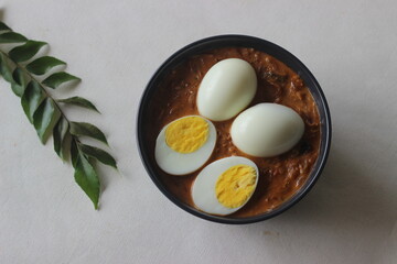 Kerala style spicy egg curry. Boiled egg in a spicy gravy of onions, tomatoes and spices. Locally known as egg roast