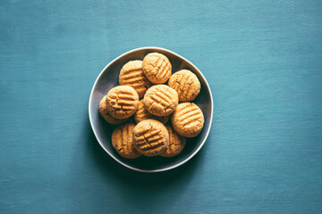 Homemade peanut cookies on a blue background