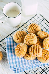 peanut butter cookies on a black wire rack. homemade baking
