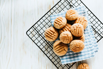 peanut butter cookies on a black wire rack. homemade baking - 441238401