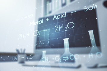 Double exposure of creative chemistry concept and modern desktop with laptop on background,...