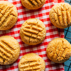 Peanut cookies on a red checkered napkin. Close-up