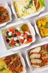 Delivery of food in containers on a white background