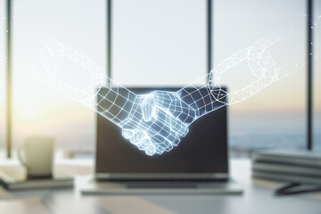 Naklejka premium Double exposure of blockchain technology with handshake hologram on laptop background. Research and development decentralization software concept