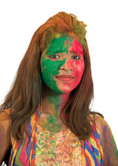 Portrait of a happy young girl with a colorful face on Holi color festival on white background