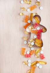 playful and colorful mix of children's vitamins and supplements with copy space