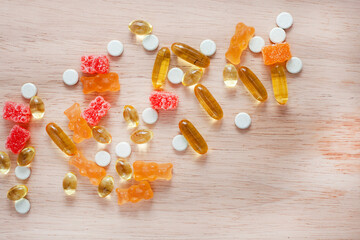 playful and colorful mix of children's vitamins and supplements with copy space