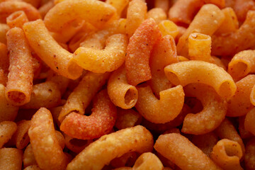 Close up of a pile of macaroni. Background of Pile of pasta