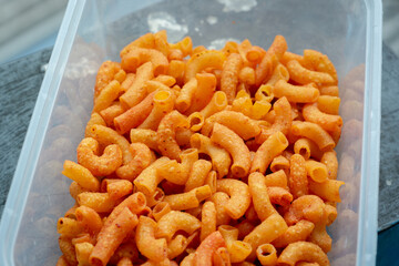 Close up of a pile of macaroni. Background of Pile of pasta