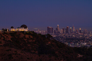 Griffith Observatory with LA skyline in the background at dusk