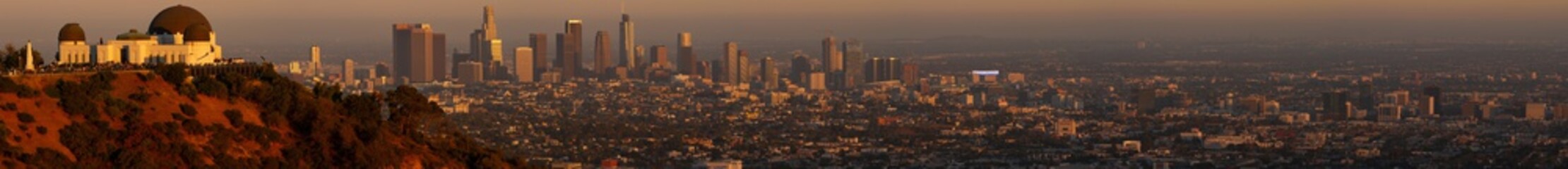 Panorama of Griffith Observatory with LA skyline in the background at sunset