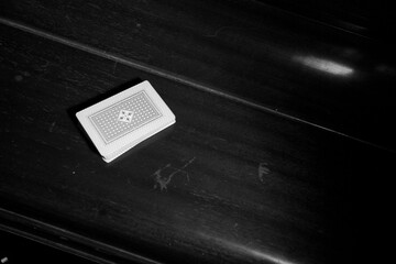 Deck of cards on wooden table with copy space and place for text