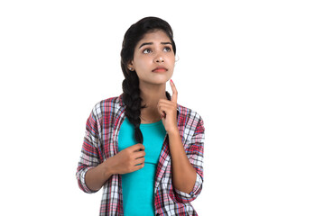 Indian girl thinking on a white background