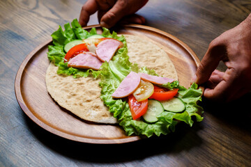 pita with vegetables and sausage.simple and delicious snack of flatbread