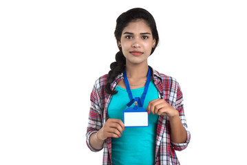 Young woman holding Identification white blank plastic id card.