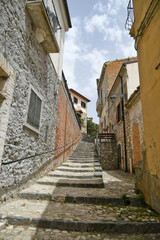 A small street between the old houses of Deliceto, a medieval village in the mountains of the Pugliaregion.
