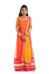 Beautiful Indian traditional girl posing on white background.