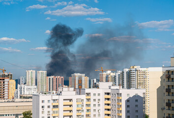 Fire in the city. High-rise buildings