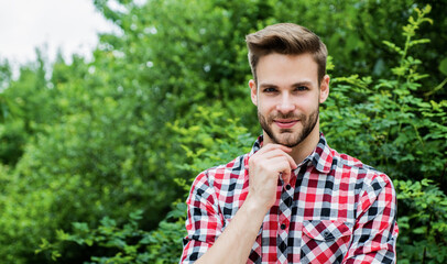 young guy with unshaven face and stylish hair, style