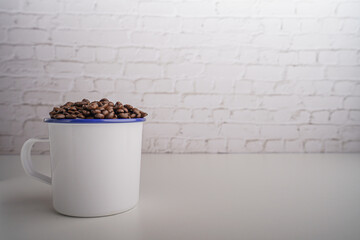coffee beans in white glass white brick background scene