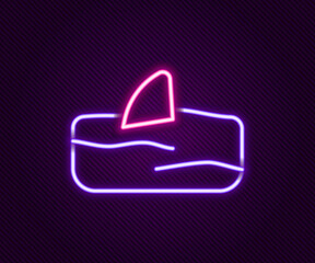 Glowing neon line Shark fin in ocean wave icon isolated on black background. Colorful outline concept. Vector