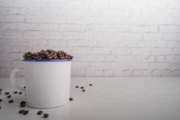 coffee beans in white glass white brick background scene