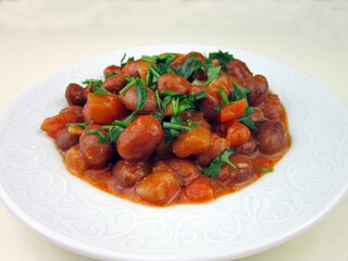 baked kidney beans on a white plate
