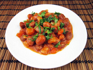 baked kidney beans on a white plate