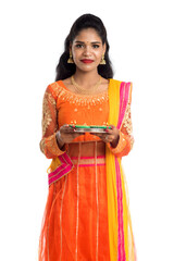 Portrait of a Indian Traditional Girl holding Diya, Girl Celebrating Diwali or Deepavali with...