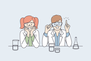 Laboratory research and tests for kids concept. Smiling happy small boy and girl children cartoon characters in white uniform sitting and making research tests with flasks together making innovations 