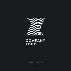 Obraz premium Black and White Zebra Z Letter Logo Design. Creative Z vector illustration with lines.