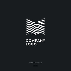 Black and White Zebra M Letter Logo Design. Creative M vector illustration with lines.