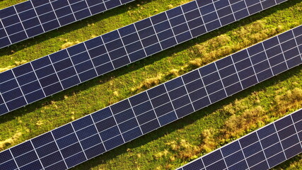 Aerial drone view flight over solar power station panels.