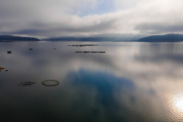 Fish Farm with fish cages in water. Aerial view of fish industry