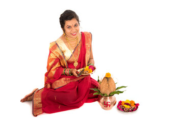 Indian Traditional Woman performing worship with copper kalash, Indian Festival, copper kalash with...