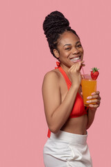 Young african american woman drinking a cocktail
