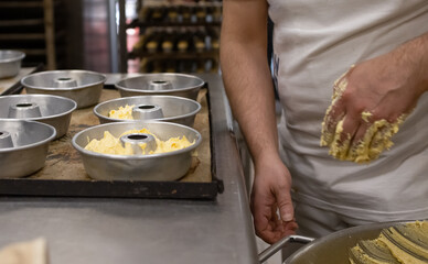 Baker makes bread for baking it