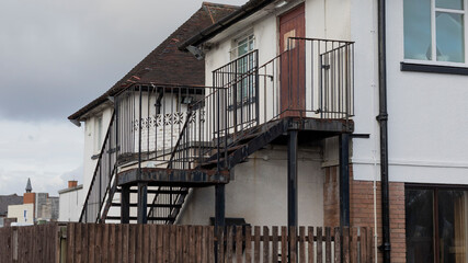 Old rusty fire escape painted black