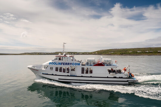 Inishmore, Aran islands, county Galway, Ireland - 18.06.2021: Aran Island express approaching harbor