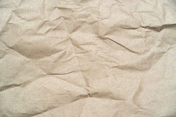 wrinkled, crumpled, brown craft recycled paper, cardboard as background