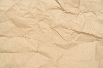 wrinkled, crumpled, brown craft recycled paper, cardboard as background