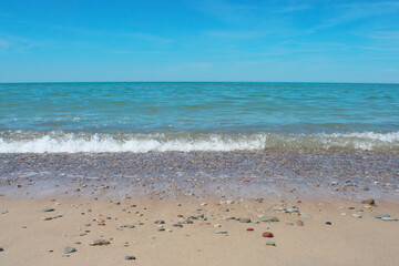 Fototapeta na wymiar Seascape. Azure sea water. Sandy Baltic coast.