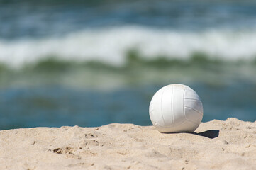 Beach volleyball ball on the sand beach. Team sport concept