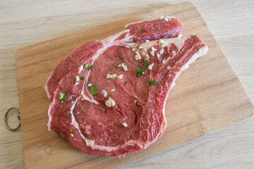 raw marinated beef steak on a cutting board