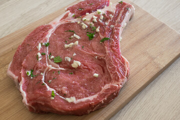 raw marinated beef steak on a cutting board