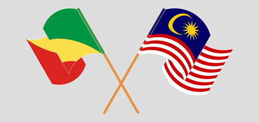 Crossed and waving flags of Republic of the Congo and Malaysia