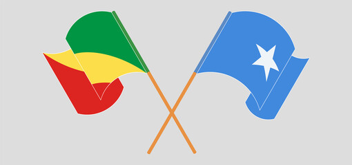 Crossed and waving flags of Republic of the Congo and Somalia