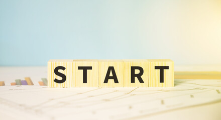 Wooden cubes with words start on financial reports.Business concept.