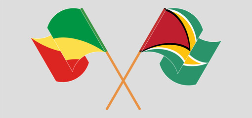 Crossed and waving flags of Republic of the Congo and Guyana